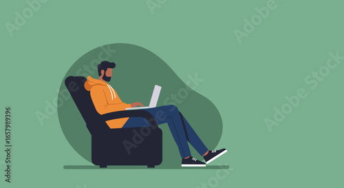 Man using laptop in armchair, working remotely or studying from home. Concept of comfort, flexibility, and modern digital lifestyle.