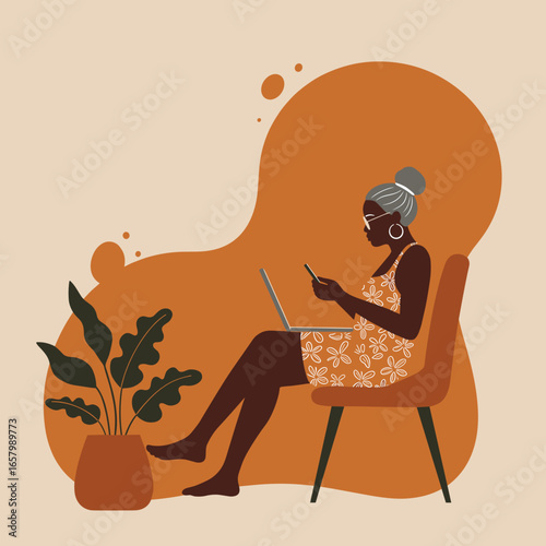 Senior woman focused on her laptop and phone while working from home. Concept of remote work, online connectivity, and comfortable digital lifestyle.