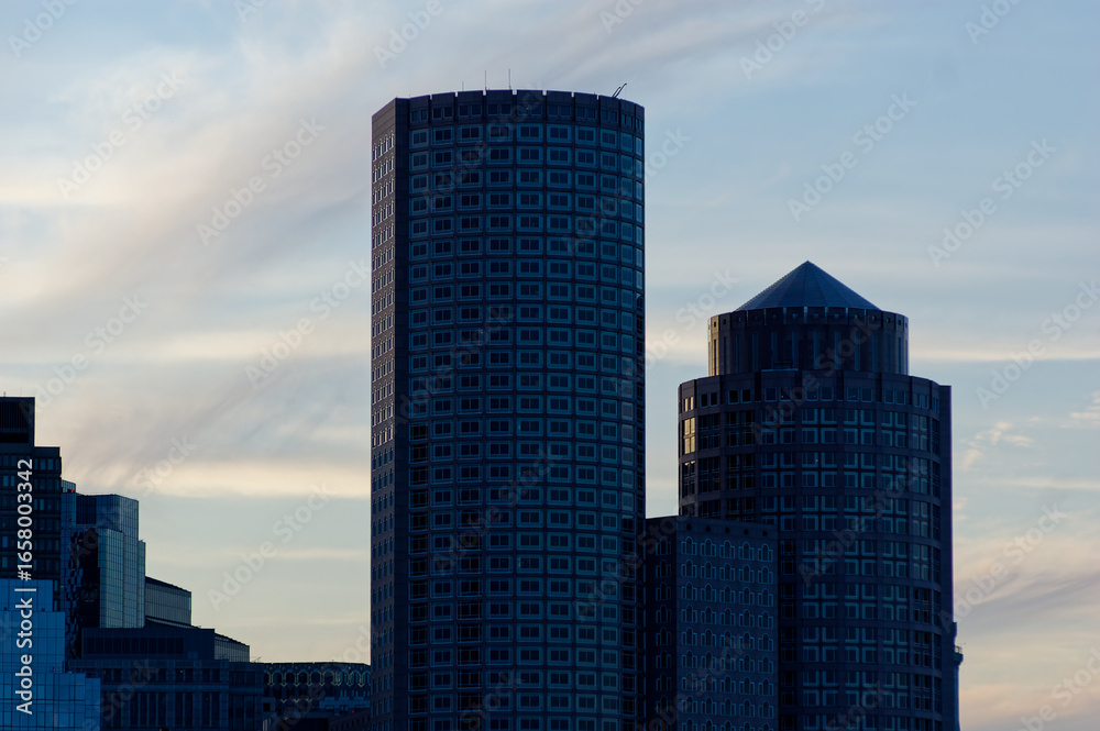 Fototapeta premium Office Towers Silhouetted at Dusk in Downtown Cityscape