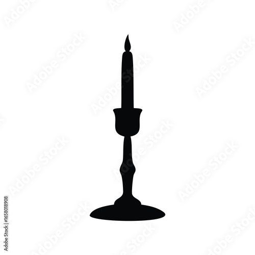 Black silhouette of a burning candle in an ornate candlestick holder