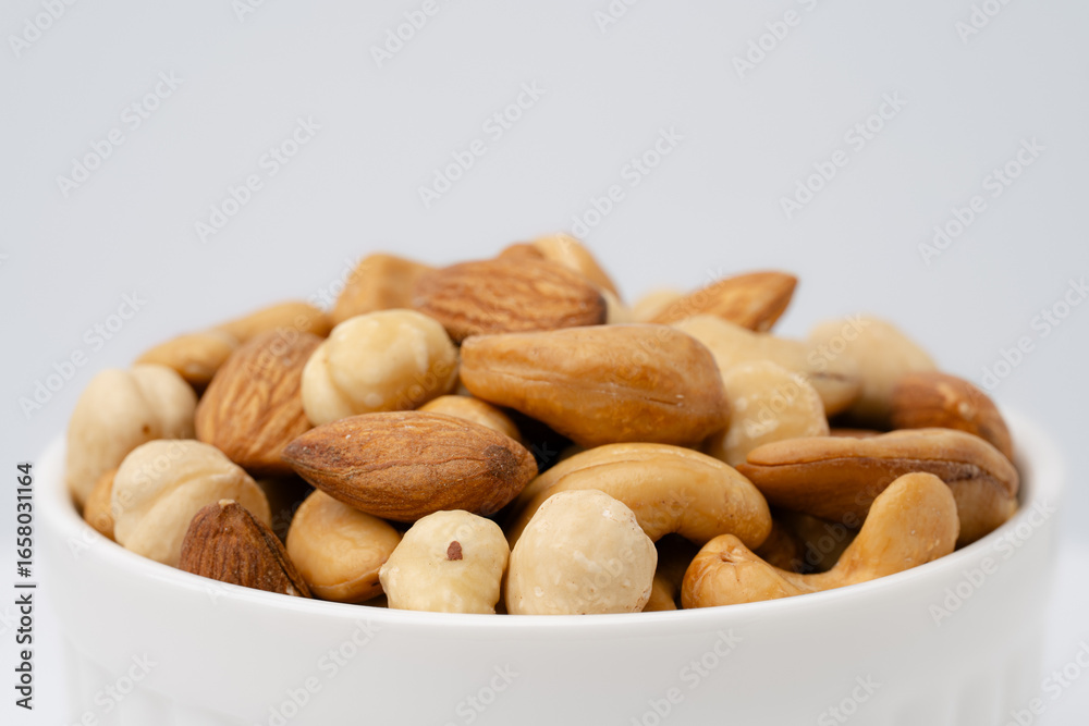 Fototapeta premium Nuts close-up. Almonds, cashews, hazelnuts. Product rich in minerals and vitamins. Healthy eating. Snack.