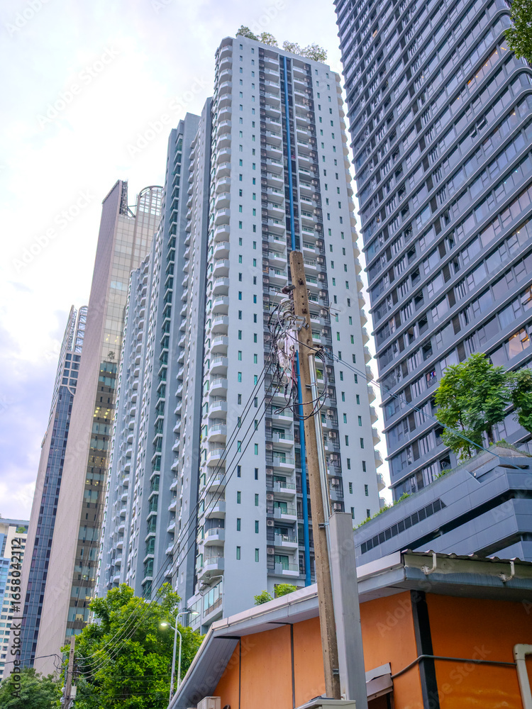 Obraz premium high rise towers building residential apartments and commercial buildings on Soi 21 Sukhumvit Rd Asoke BKK Bangkok Thailand