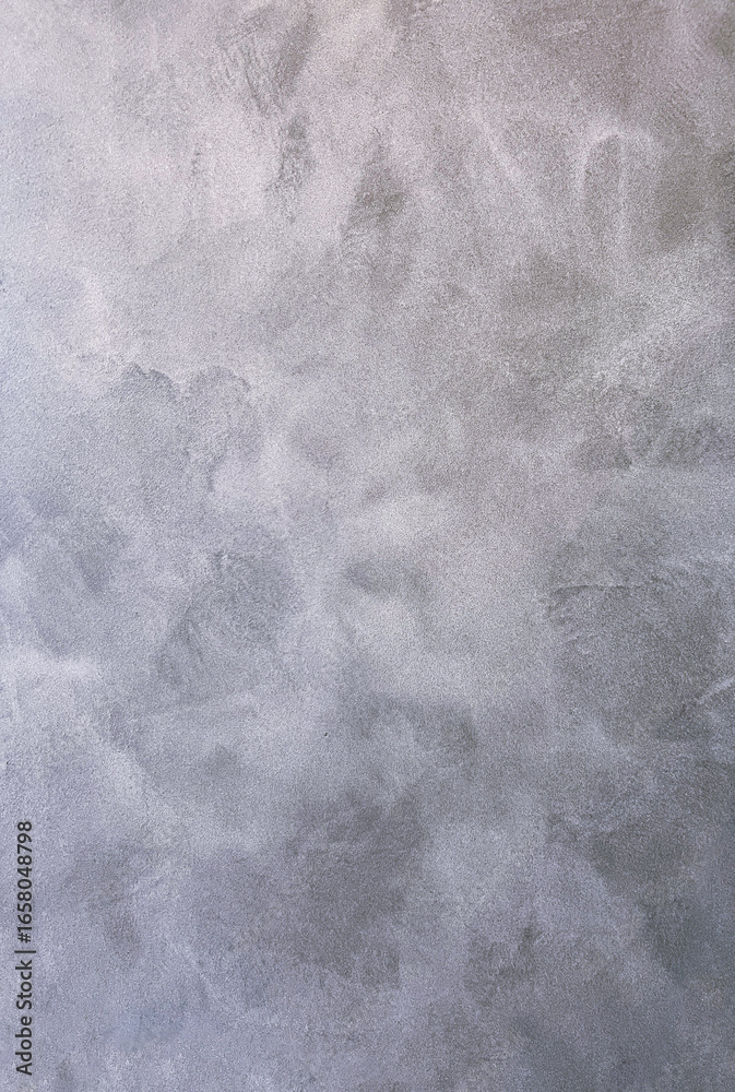 Naklejka premium Textured gray concrete wall background with subtle variations in tone and depth, ideal for design projects, presentations, and artistic applications showcasing modern aesthetics copy space
