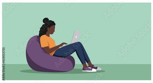 Young woman comfortably works or studies from home using her laptop on a bean bag chair, illustrating remote work, learning, or digital lifestyle.