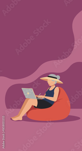 Elderly woman in a hat and glasses, relaxed on a bean bag, using a laptop. Concept of modern senior living, remote work, or online learning.