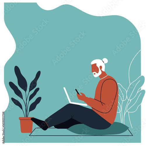 Modern man with a beard and bun, working remotely on a laptop and phone from a comfortable home setting, embracing flexible lifestyle.