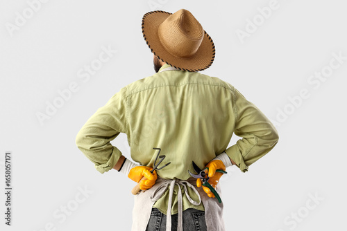 Male gardener on light back...
