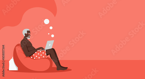 Senior man enjoying remote work or leisure on a laptop while relaxing on a bean bag chair, embodying modern retirement and connectivity.