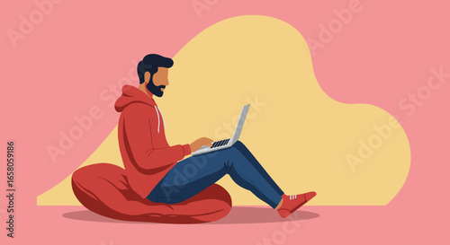 Bearded man in hoodie sits comfortably on beanbag, working on laptop. Represents remote work, online learning, and casual digital lifestyle.