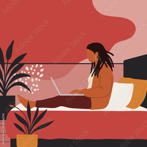 Relaxed woman with dreadlocks working on laptop in bed at home. Illustrates remote work, online learning, and modern digital lifestyle.