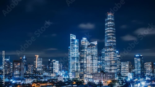 Wallpaper Mural Night cityscape view with illuminated skyscrapers and dark blue sky. Torontodigital.ca