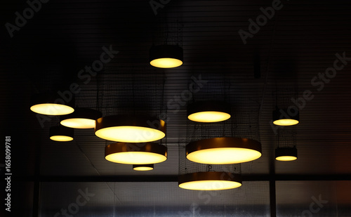 Group of Modern Circular Pendant Lights Hanging from a Ceiling