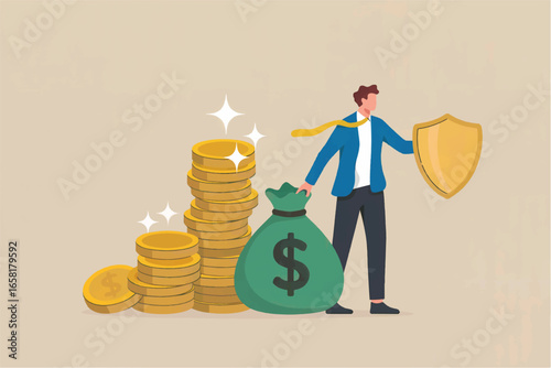Businessman protecting financial growth with shield standing beside stacked coins and money bag