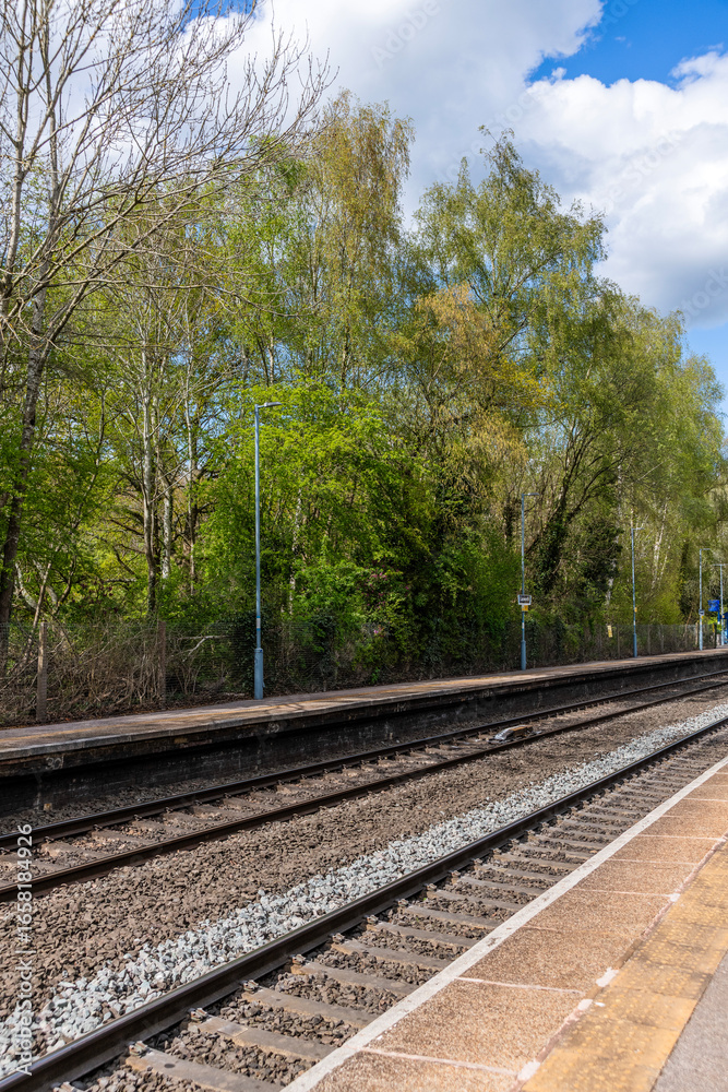 Fototapeta premium English British Rail Railways passenger suburban station. Commuter traffic in the suburbs of the West Midlands England UK. 