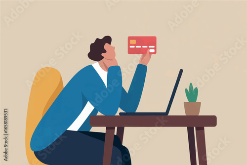 Stressed person holding credit card near laptop in office overwhelmed by financial problems or debt