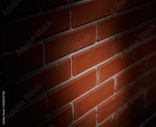 Close-Up of a Red Brick Wall with Spotlight and Vignette Effect