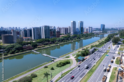 Aerial view of Marginal Pinheiros alongside Rio Pinheiros in Sao Paulo showcasing the urban landscape. Residential and commercial buildings in Sao Paulo