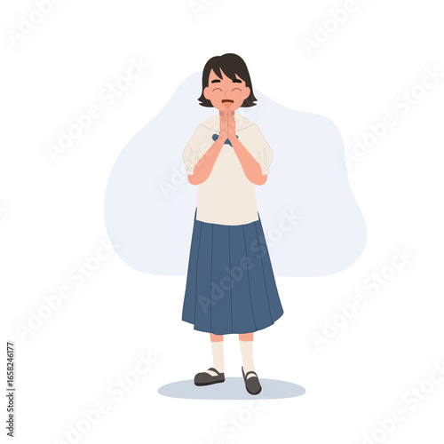 a thai primary schoolgirl in chosong uniform smiling brightly while greeting with wai gesture