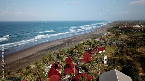 Aerial view of Parangtritis Beach in Bantul, Yogyakarta, Indonesia. Scenic coastline with rolling waves, golden sand, and tropical landscape, perfect for travel and tourism concepts.