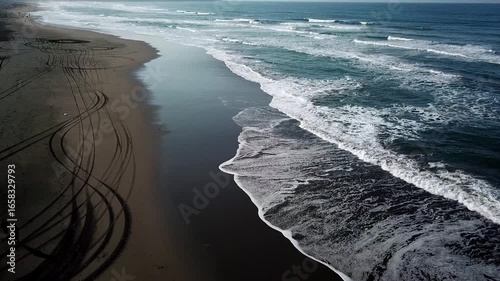Aerial view of Parangtritis Beach in Bantul, Yogyakarta, Indonesia. Scenic coastline with rolling waves, golden sand, and tropical landscape, perfect for travel and tourism concepts.