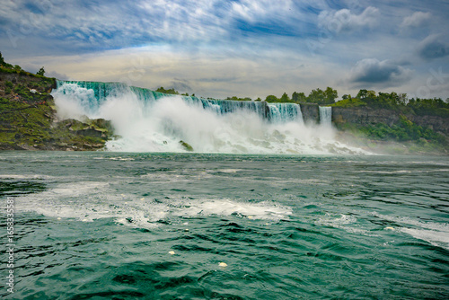 American Fall at Niagara Falls view from boat in Niagara River