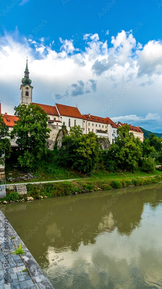 Naklejka premium European town beside river
