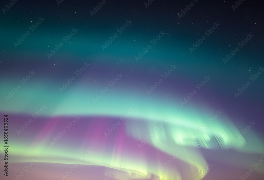 Obraz premium Aurora borealis display with green, purple, and white lights dancing across the night sky.