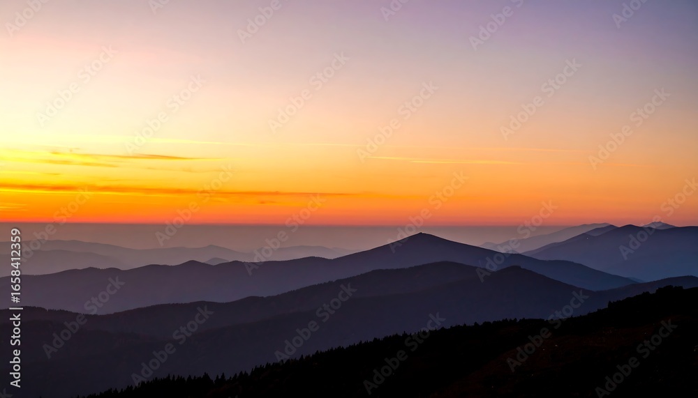 Fototapeta premium Colorful sunrise over a mountain range.
