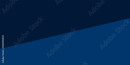 Sliced oranges neatly arranged on a plate placed against a dark blue modern