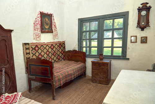  a traditional village hut with wooden furniture and antique interior
