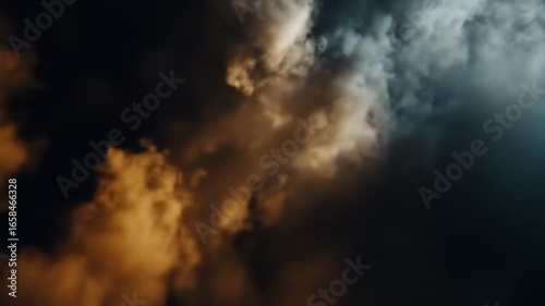 Ominous, atmospheric sky with golden and blue-grey storm clouds