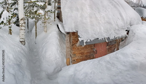 Russia. Kuznetsk Alatau. Winter view of the holiday village of Borisovka among the snow-covered impassable taiga on the banks of the Tom River.