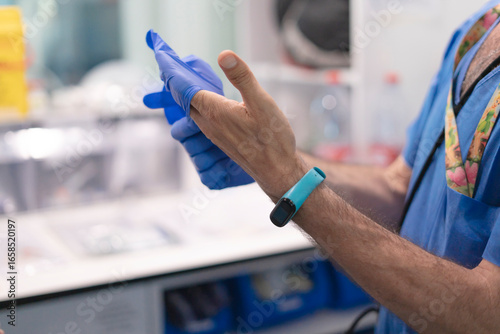 Photos Nurse putting medical syringe and test tubes in plastic bag in hospital or labor