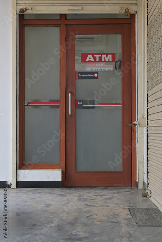 A glass door entry labeled 