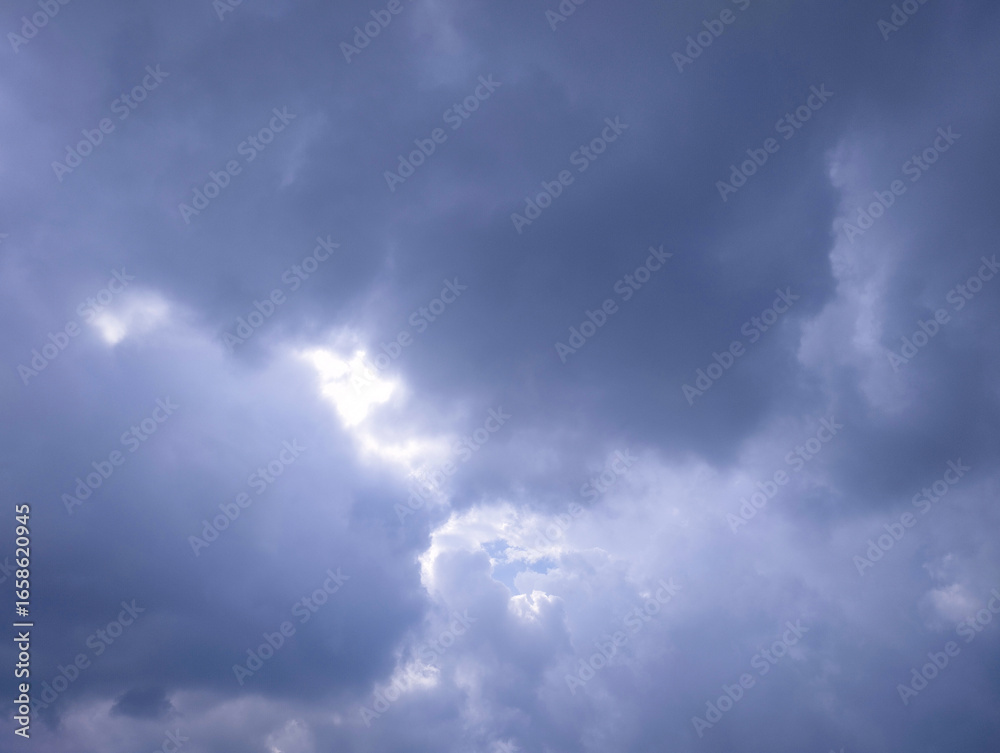 Fototapeta premium Dark Storm Clouds with Light Breaking Through