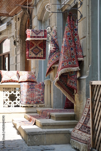 Colorful Azerbaijani carpets and textiles displayed in Baku old town in Azerbaijan