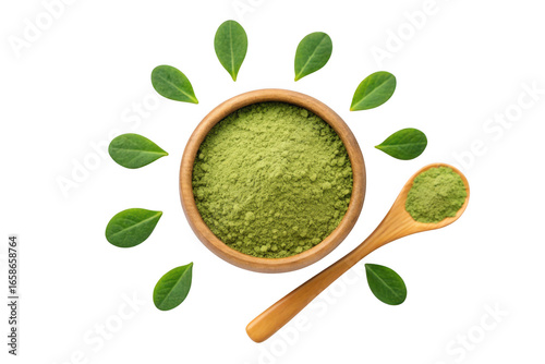 Green powder in wooden bowl with spoon and leaves isolated on transparent background