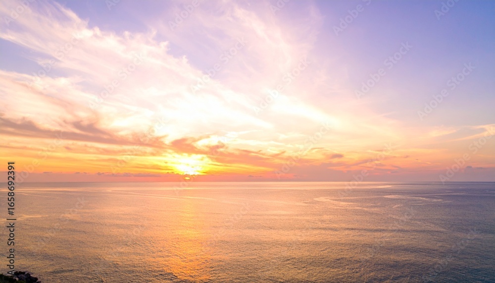 Obraz premium Lavender and Gold Sunset Glow Over a Vast, Tranquil Ocean Horizon
