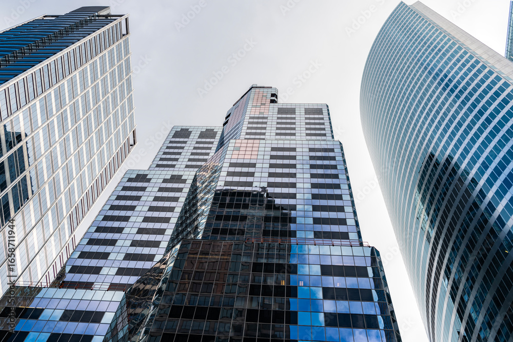 Building architecture. Business building. Glass building. Business city. City architecture. Modern glass building. Reflective glass architecture. Architecture in business district. Corporate center Building architecture. Business building. Glass building. Business city. City architecture. Modern glass building. Reflective glass architecture. Architecture in business district. Corporate center