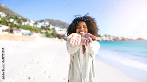 Smiling Woman Offering Sand on Sunny Beach