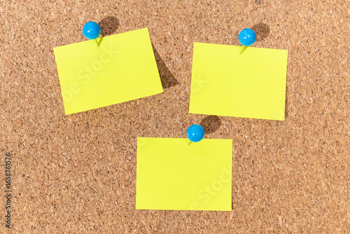 Group of Yellow sticky notes on a cork board for adding text. Template Mock up