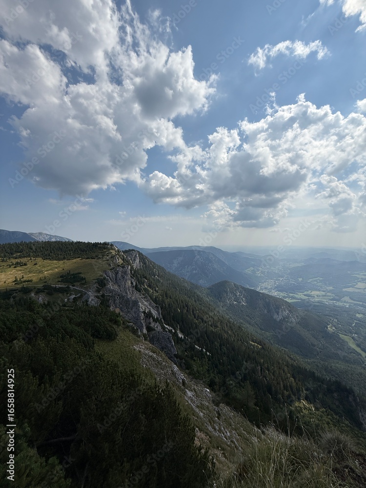 Naklejka premium clouds over the mountains