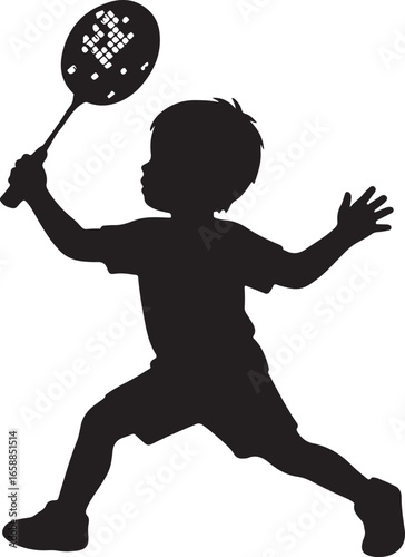 Silhouette of a young boy playing badminton hitting a shuttlecock with a racket child