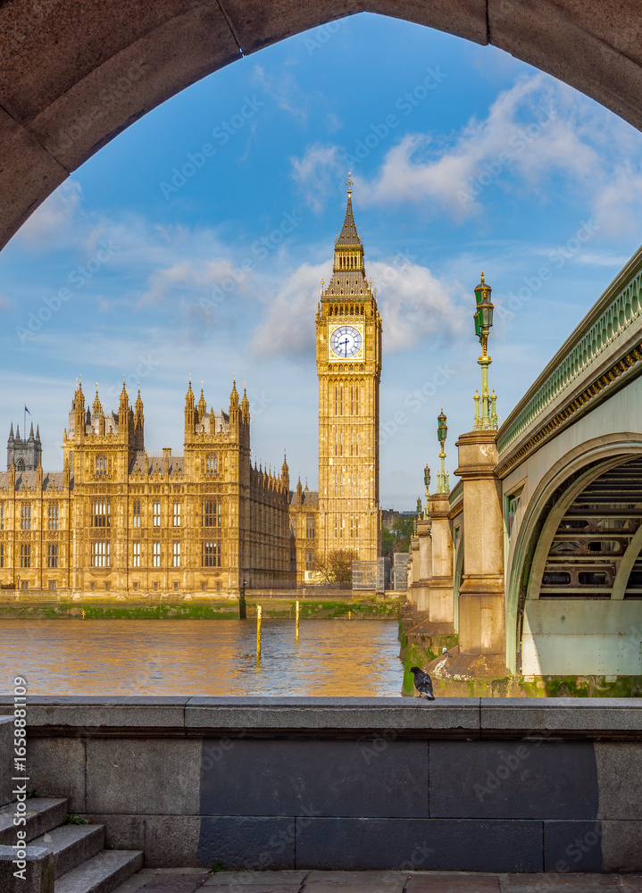 Fototapeta premium Big Ben with Houses of Parliament seen through Westminster bridge arch, London, UK