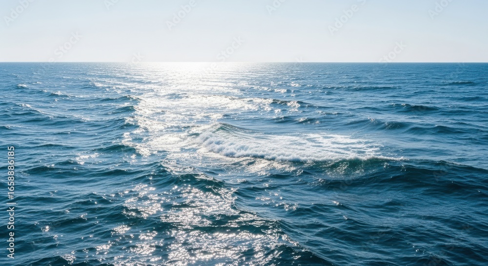 Fototapeta premium Vast Ocean Water Surface Reflecting Sunlight on a Clear Day