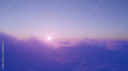 Serene purple sunrise over a sea of clouds creating a calming and ethereal view