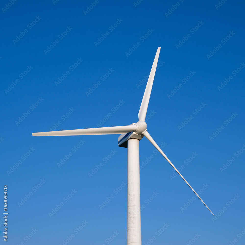 wind turbine on blue sky background wind turbine on blue sky background