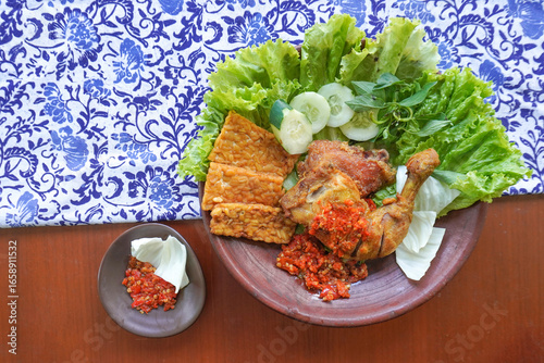 Canvas Print ayam penyet is a variant of fried chicken in Indonesia, which is served by crush