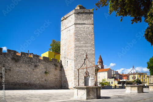 The Five Wells Square (Trg Pet Bunara), view of the Captain's tower (Kapetanova kula), medieval walls and historic city buildings, Zadar, Croatia.