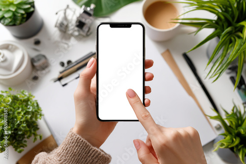 Top-down view of a woman using and pointing at a device, perfect for UX/UI demonstrations, tech branding, and digital marketing visuals.